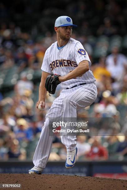 Adrian Houser of the Milwaukee Brewers pitches in the ninth inning against the Philadelphia Phillies at Miller Park on June 17, 2018 in Milwaukee,...