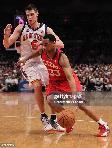 Willie Green of the Philadelphia 76ers drives to the basket against Danilo Gallinari of the New York Knicks at Madison Square Garden on March 19,...