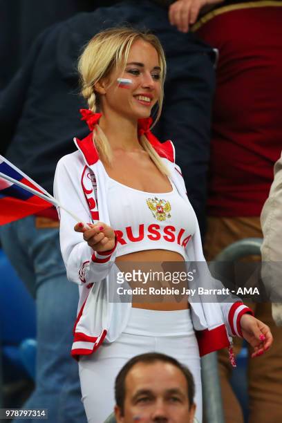 Female fan of Russia looks on during the 2018 FIFA World Cup Russia group A match between Russia and Egypt at Saint Petersburg Stadium on June 19,...