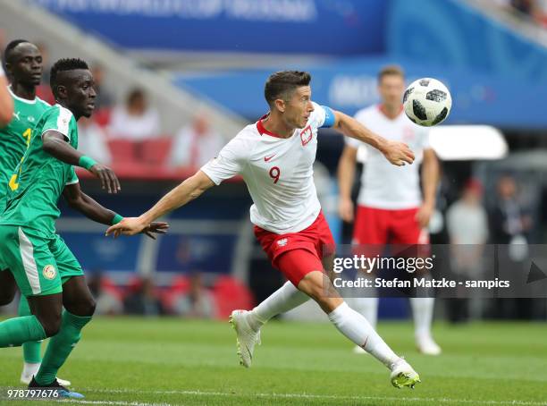 Robert Lewandowski of Poland Gana Idrissa Gueye of Senegal during the 2018 FIFA World Cup Russia group H match between Poland and Senegal at Spartak...