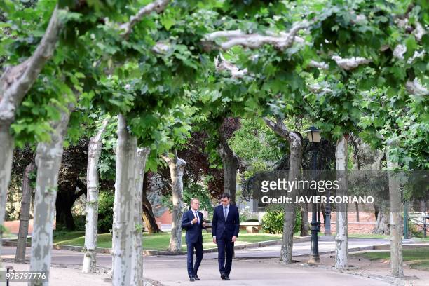 Spanish Prime Minister Pedro Sanchez and European Council President Donald Tusk walk in the garden of the Moncloa palace after their meeting in...