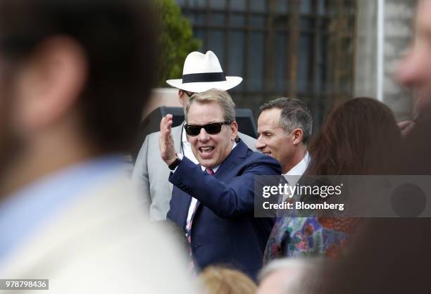 Bill Ford, executive chairman of Ford Motor Co., center, waves to attendees during an event at the Michigan Central Station in the Corktown...