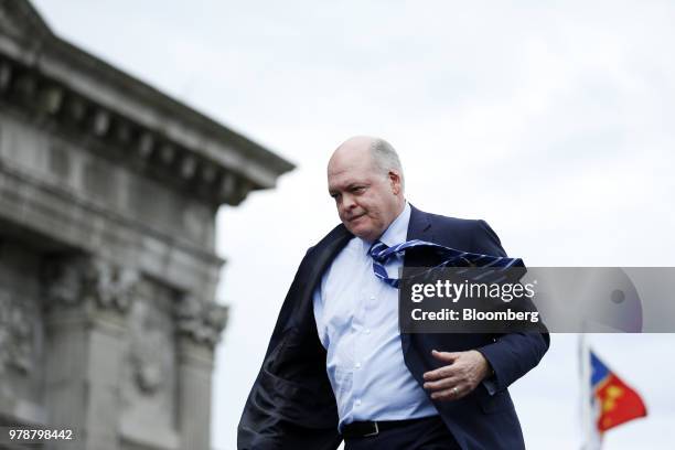 Jim Hackett, president and chief executive officer of Ford Motor Co., exits the stage after speaking during an event at the Michigan Central Station...