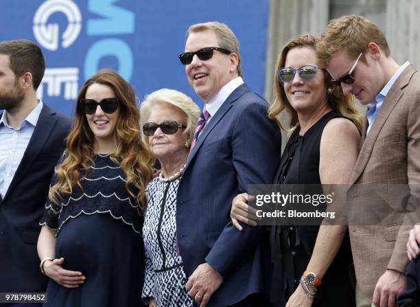 Bill Ford, executive chairman of Ford Motor Co., center, stands for a photograph with his mother Martha Firestone Ford, majority owner of the Detroit...