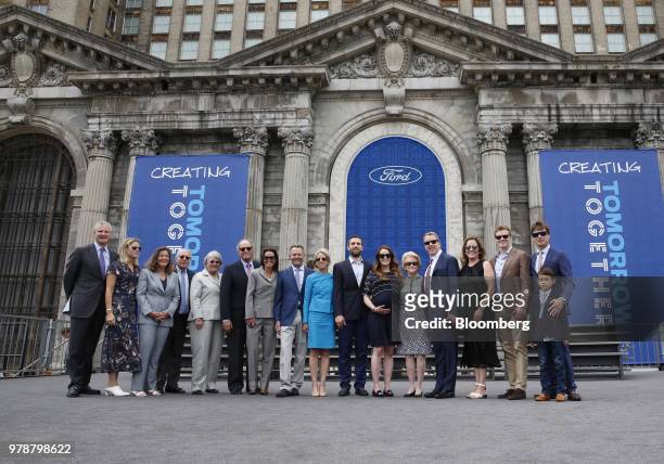 Bill Ford, executive chairman of Ford Motor Co., fifth right, stands for a photograph with his mother Martha Firestone Ford, majority owner of the...