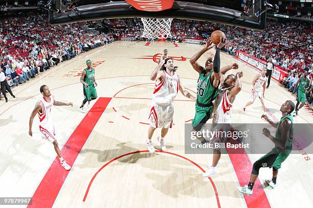 Ray Allen of the Boston Celtics shoots the ball over Chuck Hayes of the Houston Rockets on March 19, 2010 at the Toyota Center in Houston, Texas....