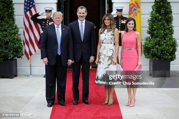 President Donald Trump, King Felipe VI of Spain, first lady Melania Trump and Queen Letizia of Spain pose for photographs outside the White House...