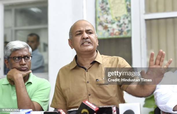 Delhi Deputy Chief Minister Manish Sisodia with AAP leader Ashutosh during a press conference at Sisodia's residence at Mathura Road on June 19, 2018...