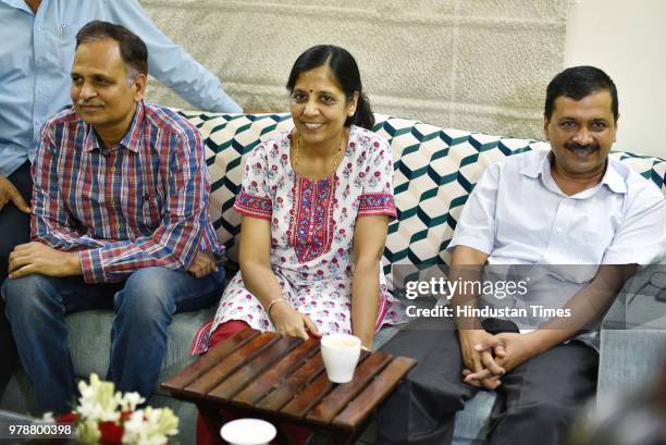 Delhi Chief Minister Arvind Kejriwal along with his wife and Health Minister Satyendra Kumar Jain after coming out of LG's house, ending nine-day...