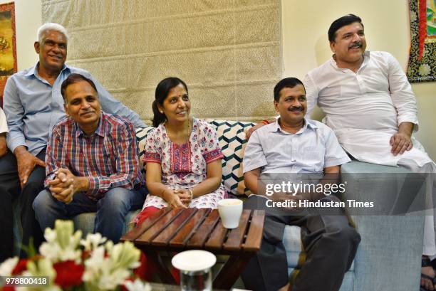 Delhi Chief Minister Arvind Kejriwal along with his wife, Health Minister Satyendra Kumar Jain and Sanjay Singh after coming out of LG's house,...