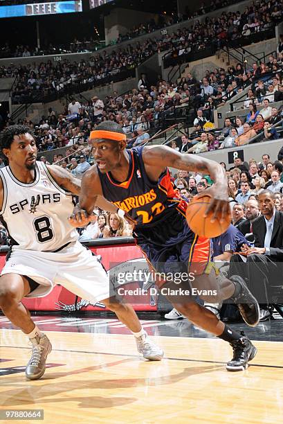 Anthony Morrow of the Golden State Warriors shoots against Roger Mason, Jr. #8 of the San Antonio Spurs on March 19, 2010 at the AT&T Center in San...