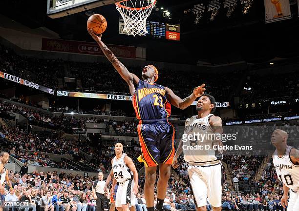 Anthony Morrow of the Golden State Warriors shoots against Roger Mason, Jr. #8 of the San Antonio Spurs on March 19, 2010 at the AT&T Center in San...