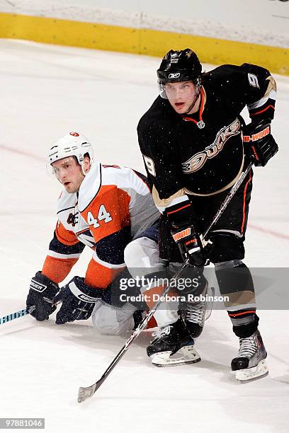 Bobby Ryan of the Anaheim Ducks defends against Freddy Meyer of the New York Islanders during the game on March 19, 2010 at Honda Center in Anaheim,...