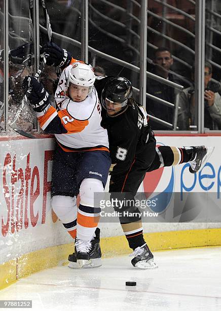 Mark Streit of the New York Islanders avoids a check from Teemu Selanne of the Anaheim Ducks during the first period at the Honda Center on March 19,...