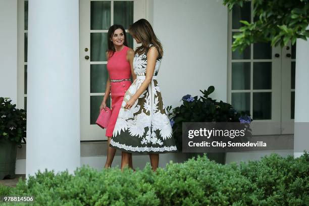 First lady Melania Trump and Queen Letizia of Spain walk along the Rose Garden Colonnade before entering the Oval Office at the White House June 19,...