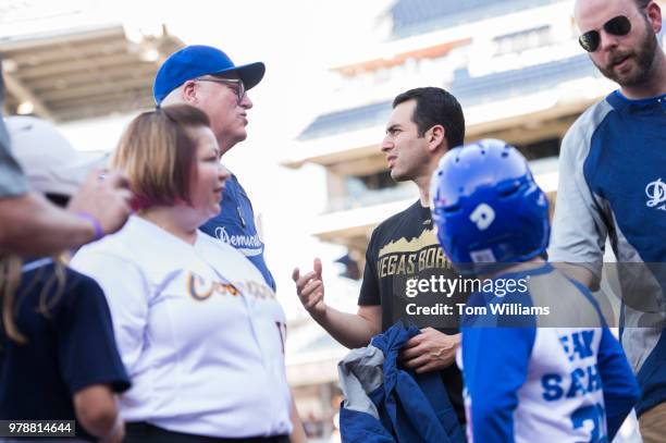 Reps. Ruben Kihuen, D-Nev., right, and Joe Crowley, D-N.Y., talk during the 57th annual Congressional Baseball Game at Nationals Park on June 14,...