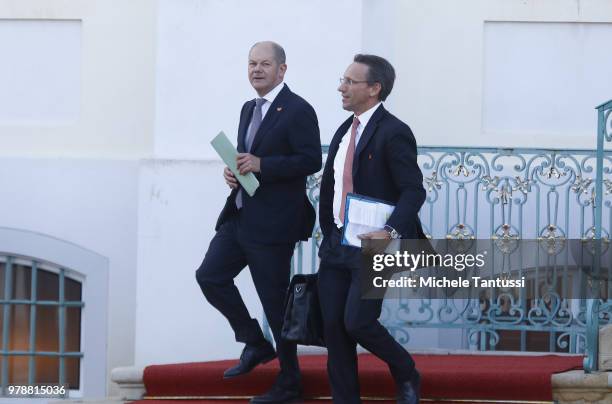 Finance Minister and vice Chancellor, Olaf Scholz , L, leaves the Schloss Meseberg governmental palace after a German-French government consultations...