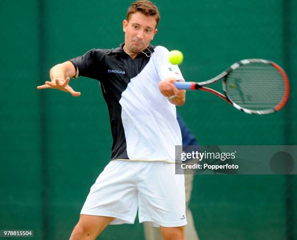 Alex Bogdanovic of Great Britain in action against Alejandro Falla of Colombia in a Singles qualifying match during the Nottingham Open tennis...