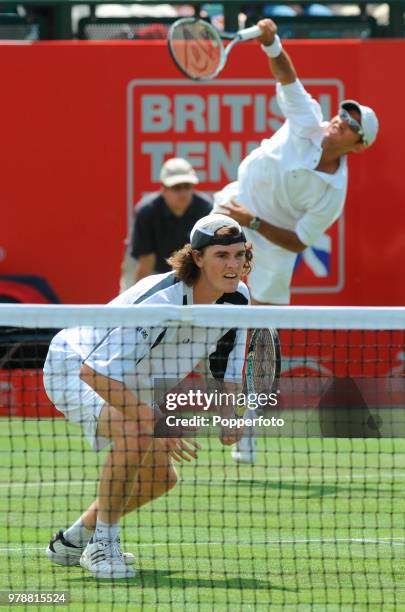 Jamie Murray of Great Britain and Jeff Coetzee of South Africa in action against Eric Butorac and Bobby Reynolds of the USA in their Doubles First...