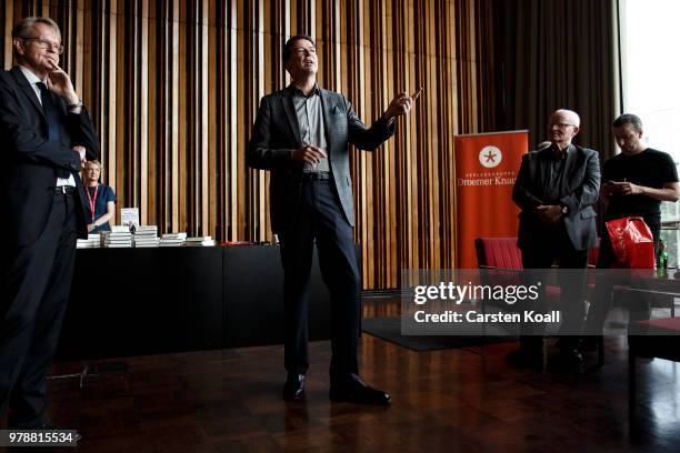 Former FBI Director James Comey talks backstage before a panel discussion about his book "A Higher Loyalty" on June 19, 2018 in Berlin, Germany....