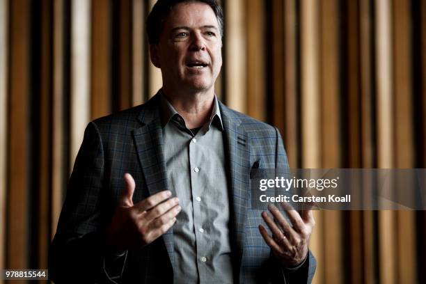 Former FBI Director James Comey talks backstage before a panel discussion about his book "A Higher Loyalty" on June 19, 2018 in Berlin, Germany....