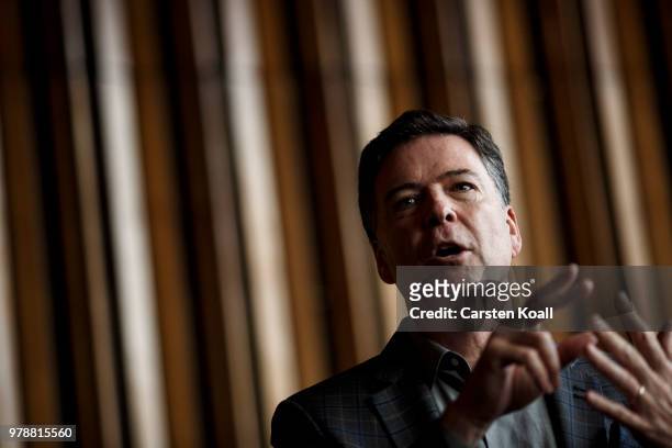 Former FBI Director James Comey talks backstage before a panel discussion about his book "A Higher Loyalty" on June 19, 2018 in Berlin, Germany....