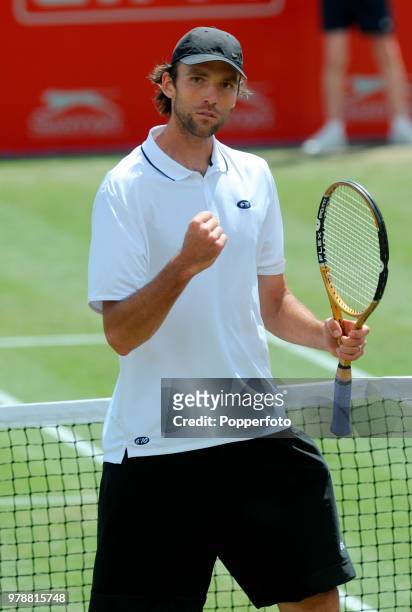 Ivo Karlovic of Croatia celebrates winning the first set in his Singles Semi-Final match against Gael Monfils of France during the Nottingham Open...