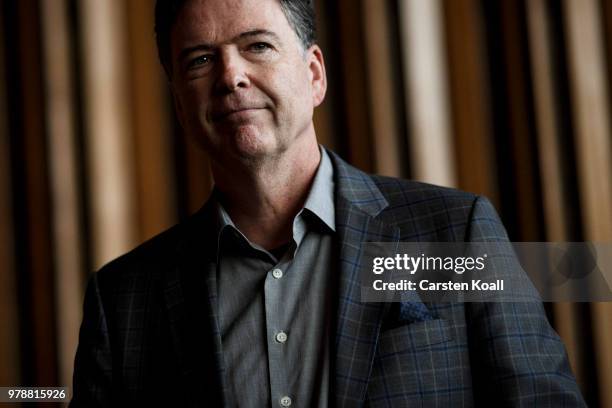 Former FBI Director James Comey talks backstage before a panel discussion about his book "A Higher Loyalty" on June 19, 2018 in Berlin, Germany....