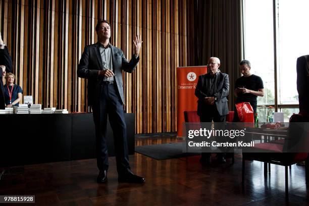 Former FBI Director James Comey talks backstage before a panel discussion about his book "A Higher Loyalty" on June 19, 2018 in Berlin, Germany....