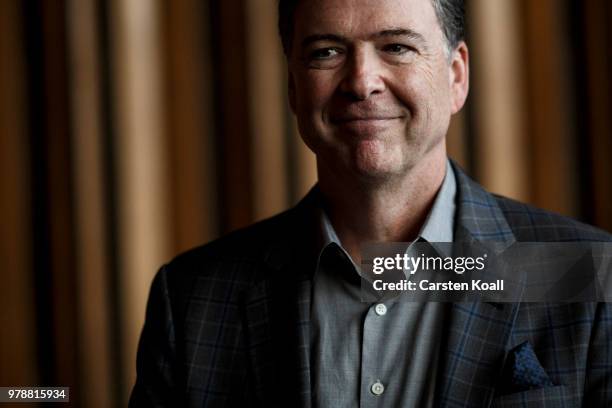 Former FBI Director James Comey talks backstage before a panel discussion about his book "A Higher Loyalty" on June 19, 2018 in Berlin, Germany....