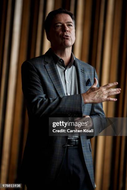 Former FBI Director James Comey talks backstage before a panel discussion about his book "A Higher Loyalty" on June 19, 2018 in Berlin, Germany....