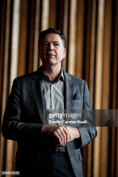 Former FBI Director James Comey talks backstage before a panel discussion about his book "A Higher Loyalty" on June 19, 2018 in Berlin, Germany....