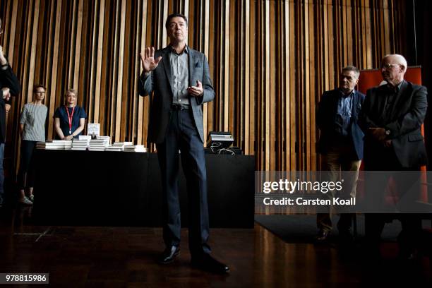 Former FBI Director James Comey talks backstage before a panel discussion about his book "A Higher Loyalty" on June 19, 2018 in Berlin, Germany....