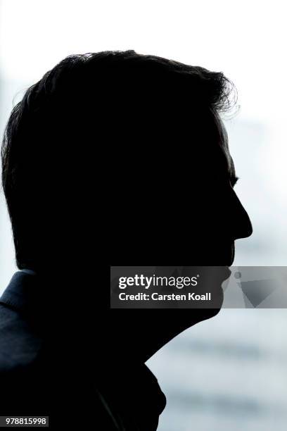 Former FBI Director James Comey talks backstage before a panel discussion about his book "A Higher Loyalty" on June 19, 2018 in Berlin, Germany....