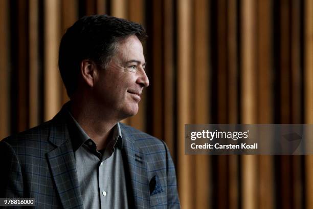 Former FBI Director James Comey talks backstage before a panel discussion about his book "A Higher Loyalty" on June 19, 2018 in Berlin, Germany....