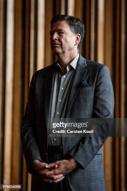 Former FBI Director James Comey talks backstage before a panel discussion about his book "A Higher Loyalty" on June 19, 2018 in Berlin, Germany....