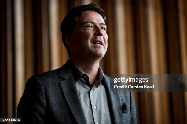 Former FBI Director James Comey talks backstage before a panel discussion about his book "A Higher Loyalty" on June 19, 2018 in Berlin, Germany....