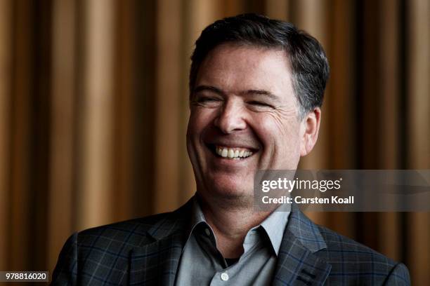 Former FBI Director James Comey talks backstage before a panel discussion about his book "A Higher Loyalty" on June 19, 2018 in Berlin, Germany....