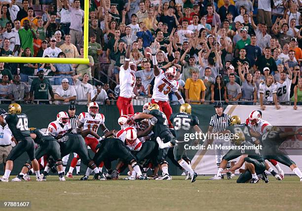 South Florida kicker Kyle Bronson converts an extra point against Louisville September 24, 2005 in Tampa. The unranked Bulls upset eighth ranked...