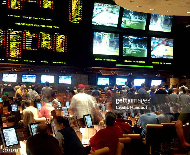 In this handout provided by the Las Vegas News Bureau, the Mirage Resort Race and Sports Book in Las Vegas is shown crowded with basketball fans...