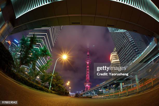 shanghai orient pearl tower illuminated in red in the night,celebrating a chinese traditional holiday,china - chinese tower imagens e fotografias de stock