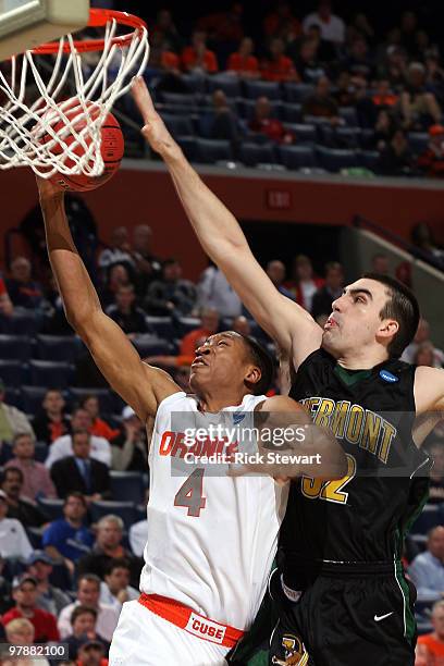 Wes Johnson of the Syracuse Orange goes to the hoop against Evan Fjeld of the Vermont Catamounts during the first round of the 2010 NCAA men's...