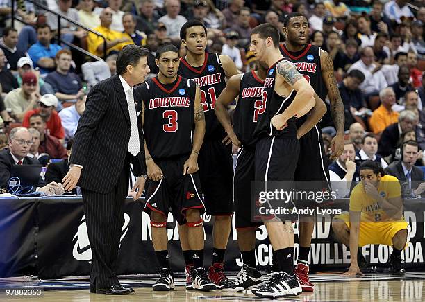 Rick Pitino the Head Coach of the Louisville Cardinals talks to his team in the game against the California Golden Bears during the first round of...