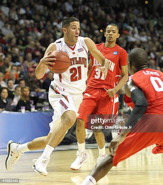 Greivis Vasquez of the Maryland Terrapins drives against Kelvin Lewis of the Houston Cougars during the first round of the 2010 NCAA men's basketball...