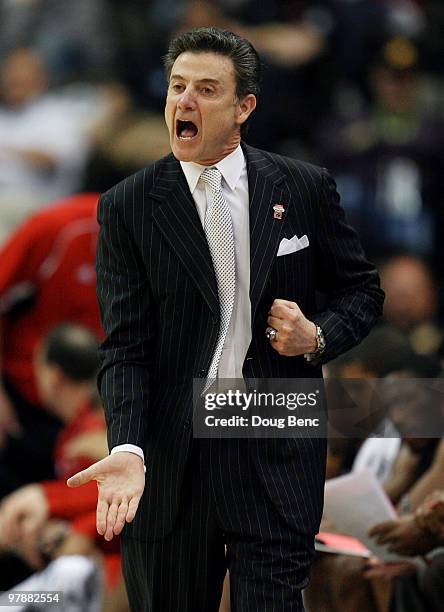 Rick Pitino head coach of the Louisville Cardinals yells out to his team while facing the California Golden Bears during the first round of the 2010...