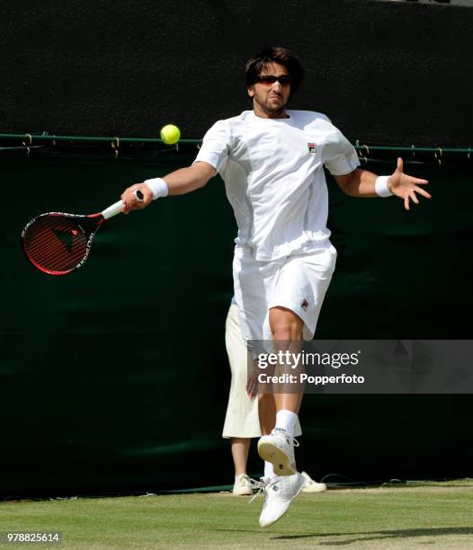 Janko Tipsarevic of Serbia in action against Dmitry Tursunov of Russia in their Men's Singles Third Round match during the Wimbledon Lawn Tennis...