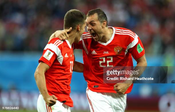 Artem Dzyuba and Roman Zobnin of Russia celebrate the first Russia goal, an own goal by Ahmed Fathi of Egypt, during the 2018 FIFA World Cup Russia...