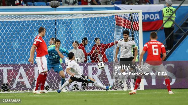 Ahmed Fathi of Egypt scores an own goal past team mate Mohamed Elshenawy to put Russia in front 1-0 during the 2018 FIFA World Cup Russia group A...
