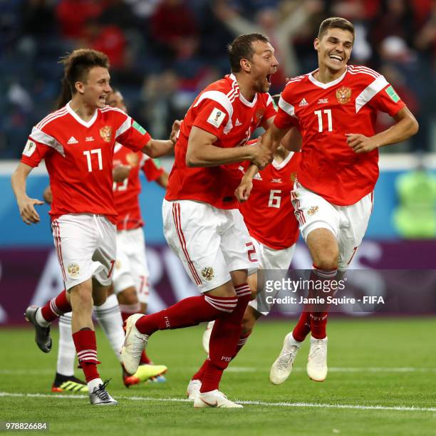 Artem Dzyuba and Roman Zobnin of Russia celebrate the first Russia goal, an own goal by Ahmed Fathi of Egypt, during the 2018 FIFA World Cup Russia...