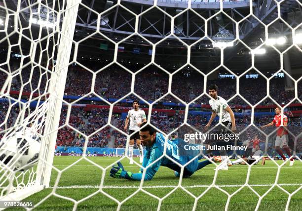 Ahmed Fathi of Egypt scores an own goal past team mate Mohamed Elshenawy to put Russia in front 1-0 during the 2018 FIFA World Cup Russia group A...